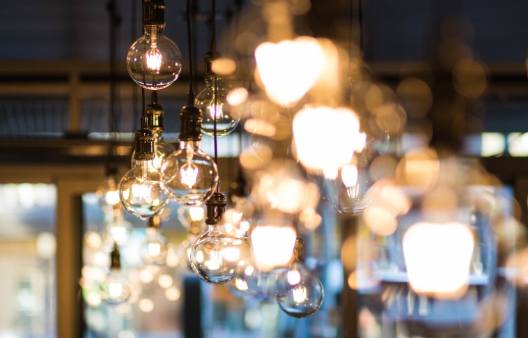 What Carries the Useful Energy from a Lamp to Its Surroundings?