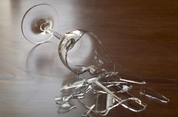 What risks does broken glass pose at home